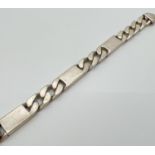 A heavy silver 9 inch Figaro style chain bracelet with lobster clasp. Silver marks to claps and