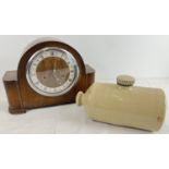 A vintage dark wood cased striking mantel clock together with stoneware Pearson, Chesterfield hot