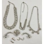 A collection of vintage clear stone diamante jewellery, to include 3 necklaces, earrings and a