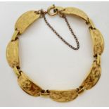 A vintage rolled gold 7 panel bracelet with floral engraved design. With spring ring clasp &