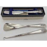 3 vintage silver handled items. A boxed mid century butter knife with Queens pattern embossed