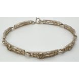 A silver Rennie Mackintosh style 7 panel bracelet with spring ring clasp. Silver mark to clasp.
