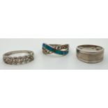 3 silver band style rings. A plain band with brushed design central panel, a Greek key design