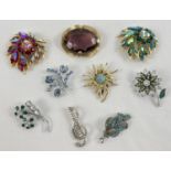 A collection of 9 Stone set vintage brooches in varying sizes and designs to include examples by