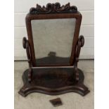 A Victorian mahogany dressing table/vanity swing mirror with carved finial and serpentine shaped