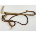 A vintage plaited leather hunting whip with antler horn handle and brass mount.