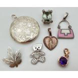 A collection of silver and white metal jewellery items to include Thomas Sabo hanging charm set with