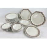 A collection of Adams dinner ware in "Sharon" brown shamrock pattern. Comprising: 17 plates, 2
