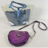 A clear plastic and denim tote bag by Suzy Smith. Together with A purple patent heart shaped over