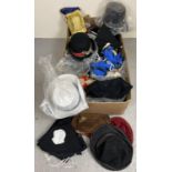 A box of theatre costume hats and accessories.