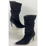 A pair of slim heeled black suede ruched style calf length ladies boots. Size 40.