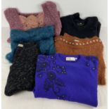 A collection of ladies jumpers in various styles and designs to include beaded. To include