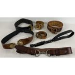 7 leather belts in various styles and sizes. Most with metal buckles or fastenings. To include