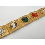 A vintage 8 panel 18ct brushed gold bracelet set with varying colour semi-precious stone cameos.