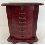 A vintage wooden chest style jewellery box. 6 front opening drawers with small square compartments