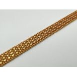 A 22ct gold flat popcorn and ball chain weave style bracelet with lobster claw clasp. Gold marks