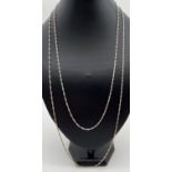 2 silver Singapore style chain necklaces, both with lobster style clasps. A 30" chain together
