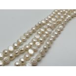 A 34 inch string of white freshwater potato pearls.