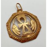 An octagonal 22ct gold Ankh, symbol of life & floral design pendant, on hanging bale. Egyptian