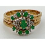 A 9ct gold emerald and diamond triple ring/bridal set. Central ring set with a marquise cut