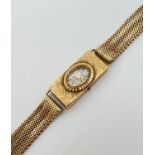 A vintage 18 ct gold ladies wristwatch by Cortebert. Gold case and mesh strap with hallmarks to