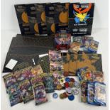 A collection of assorted PokÃ©mon trading card packaging and booklets. To include: Elite Trainer box