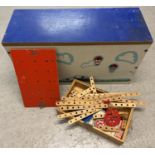 A vintage wooden toy box containing a quantity of assorted vintage Bilo Toy wooden construction