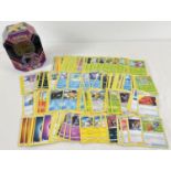 200 assorted PokÃ©mon cards in an Eternatus V Powers PokÃ©mon V trading card game tin.