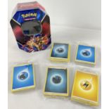 5 packs of assorted PokÃ©mon energy cards in a Galar Legend Zacian PokÃ©mon V trading card game tin.