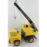 A large sized pressed metal and plastic Tonka crane truck with Toymaster decals.
