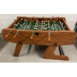 A modern wooden framed table football game by BCE Table Sports, complete with 6 footballs. Approx.