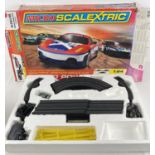A boxed Micro Scalextric Turbo Power electronic racing set with 1 car (2 cars missing).
