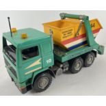 A 1:16 scale hard plastic F16 Intercooler Volvo skip lorry, by Bruder. Moving parts throughout.