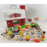 A 1990's Fisher Price Little People Farm barn and play pieces. To include animals, tractor,