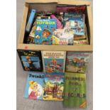 A large box of children's books and annuals to include The Magic Roundabout, The Bionic Woman,