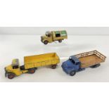 3 1950's Dinky toys diecast lorries, all in play worn condition. #252 Bedford Refuse wagon with fawn