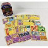 200 assorted PokÃ©mon cards in a Galar Legend Zacian PokÃ©mon V trading card game tin.