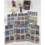 Collection of Yu-Gi-Oh trading cards, toys and collectables. Comprising: 45 Ultra Rare trading