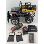 A New Bright remote control Jeep monster truck. Comes with 2 batteries, remote unit and charger.