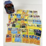 210 assorted PokÃ©mon cards in a Galar Legend Zamazenta PokÃ©mon V trading card game tin.
