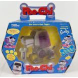 A boxed 2000 Tiger Electronics/Hasbro Toys Poo-Chi interactive puppy. Item no. 70671.