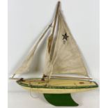 A vintage wooden SY4 pond yacht by Star, with cream and green painted hull. Approx. 50cm x 42cm with