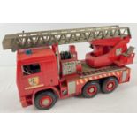 A 1:16 scale hard plastic fire engine with extending and tipping ladder by Bruder. Moving parts