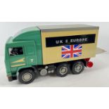 A 1:16 scale hard plastic green and grey Volvo container lorry with tailgate to rear, by Bruder.