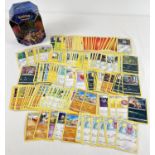 200 assorted PokÃ©mon cards in a Galar Legend Zacian PokÃ©mon V trading card game tin.