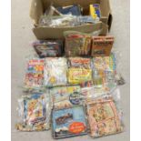 A large box of assorted vintage jigsaws, mostly boxed & bagged.