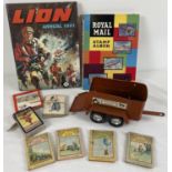 A small collection of assorted misc toys & books. To include: Nylint tin plate horse trailer,