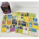 200 assorted PokÃ©mon cards in an Eternatus V Powers PokÃ©mon V trading card game tin.