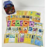 200 assorted PokÃ©mon cards in a Galar Legend Zacian PokÃ©mon V trading card game tin.