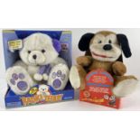 2 boxed battery operated plush bear toys. A 2001 Wellmark Radio Teddy together with a singing animal